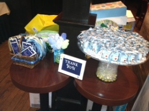 The favor table; handmade bookmarks & Little scented candles in the shape of a blue baby Owl. 